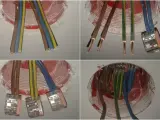 Instalacja elektryczna: jakie kabel do gniazdek? Widać przewody fazowe, neutralne i ochronne w puszkach instalacyjnych.