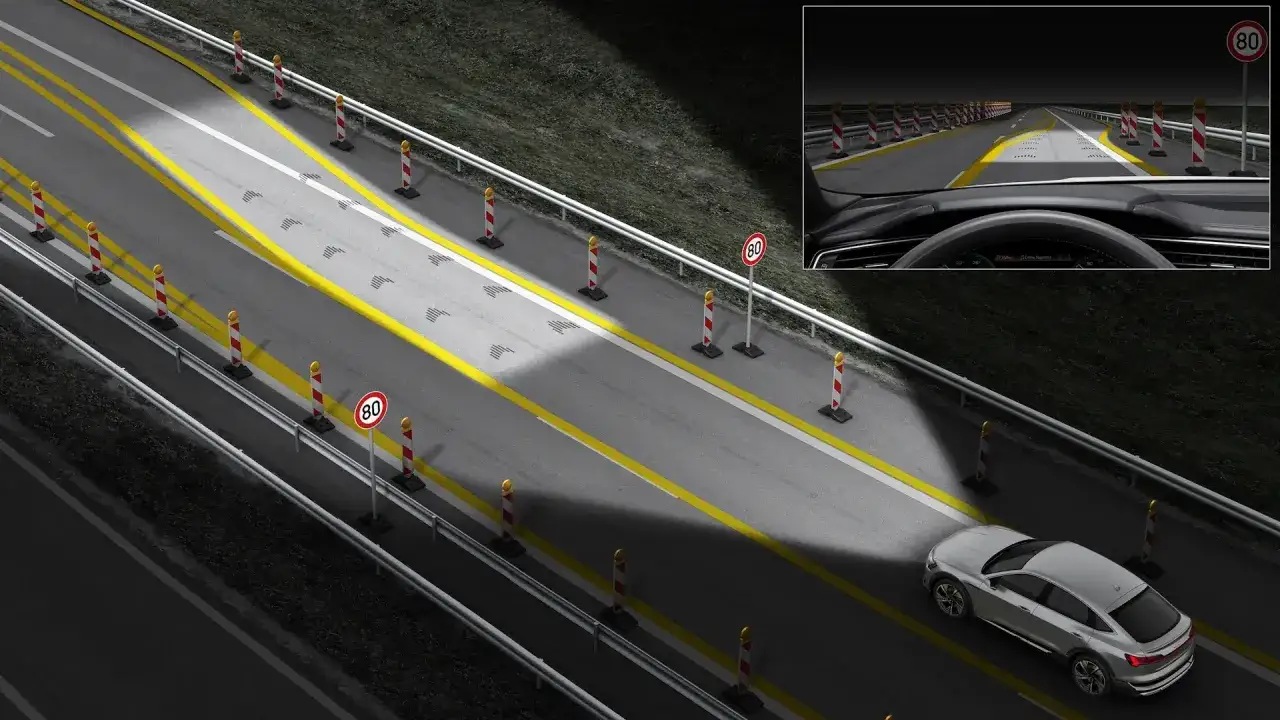 Inteligentne światła matrix oświetlają drogę, kierując pojazd przez strefę robót drogowych z ograniczeniem do 80 km/h.